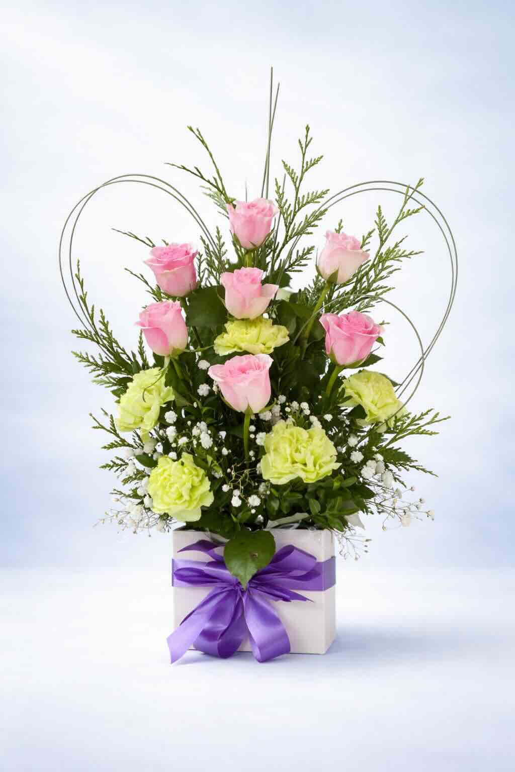 Pretty pink rose and green hydrangea floral arrangement in a white box with a lilac ribbon, created by Emflowerment Florist in Croydon and available for Melbourne delivery.