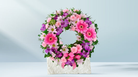Floral Wrath arrangement with pink and purple flowers