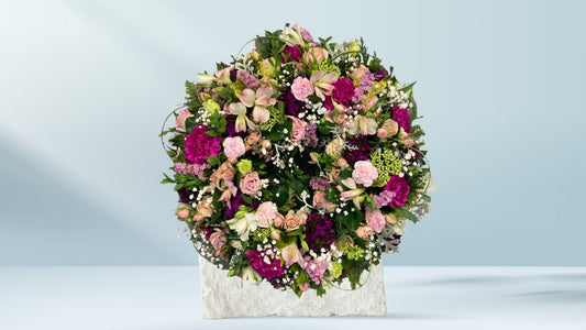 Handcrafted funeral wreath featuring seasonal flowers, available for Croydon funeral and memorial delivery by Emflowerment.